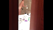 Pervert films blonde girl during orgasm in hotel shower